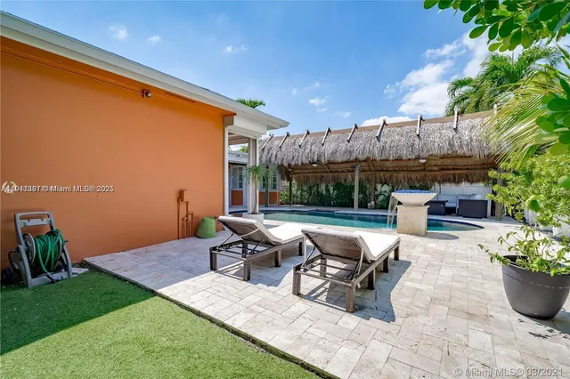an aerial view of multiple houses with yard