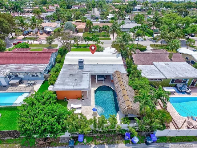 an aerial view of residential houses with outdoor space