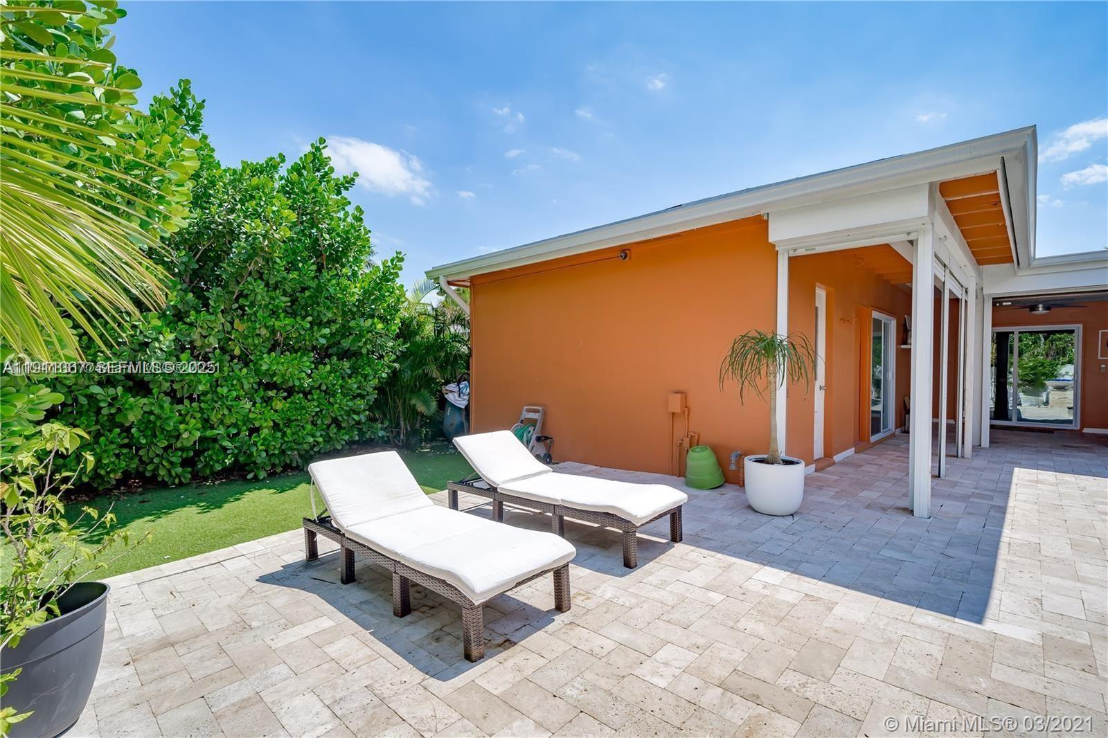 1309 Funston Street, Unit 1309 Hollywood, FL 33019 - Photo 45 of 50 a outdoor space with chairs and couch