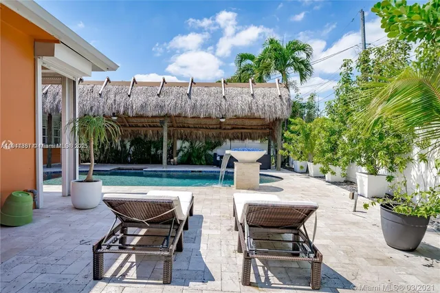 a view of a swimming pool with a patio