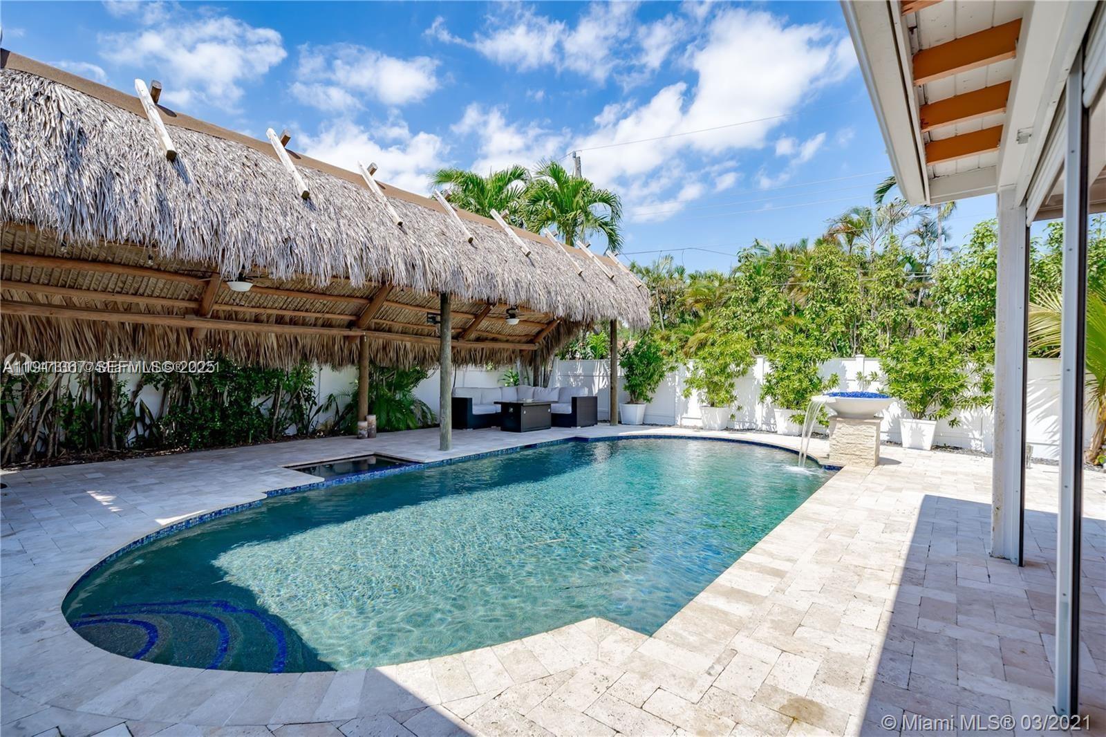 1309 Funston Street, Unit 1309 Hollywood, FL 33019 - Photo 49 of 50 a view of a swimming pool with a patio
