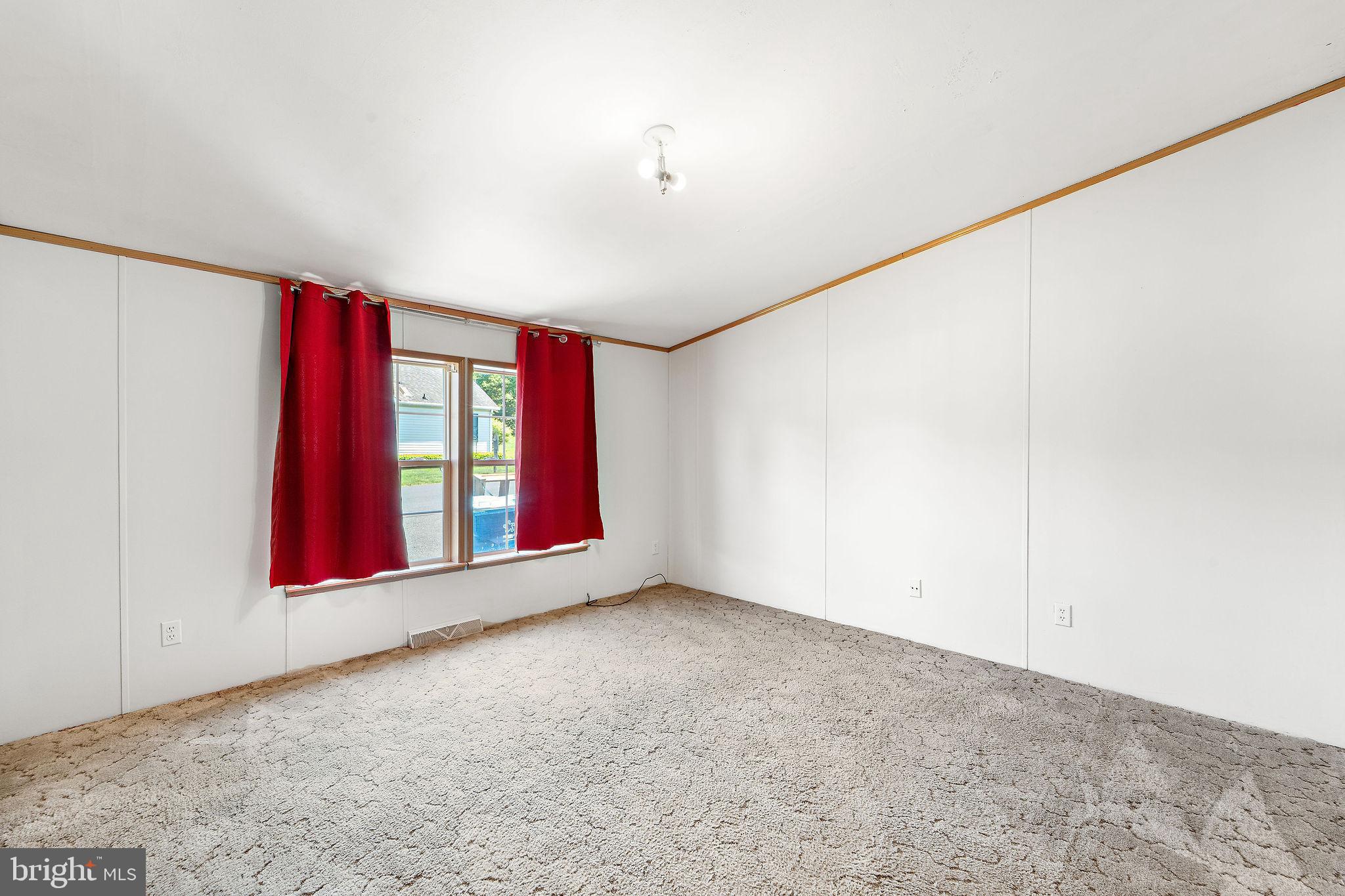 402 Ford Hook Road Doylestown, PA 18901 - Photo 12 of 26 a view of an empty room with window bathroom and front door