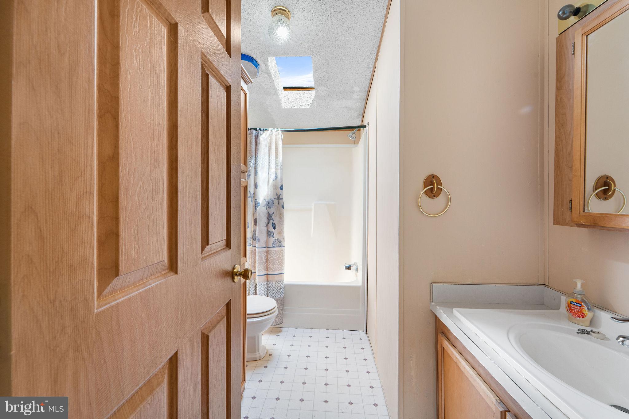 402 Ford Hook Road Doylestown, PA 18901 - Photo 14 of 26 a bathroom with a sink a toilet and shower