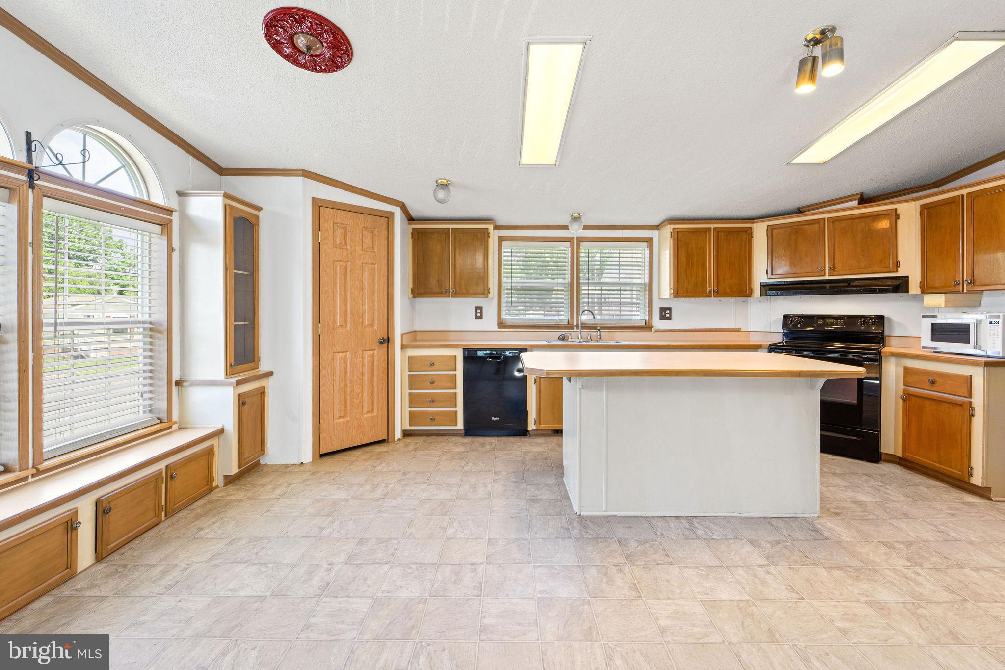 402 Ford Hook Road Doylestown, PA 18901 - Photo 17 of 26 a large kitchen with stainless steel appliances granite countertop a stove and a sink