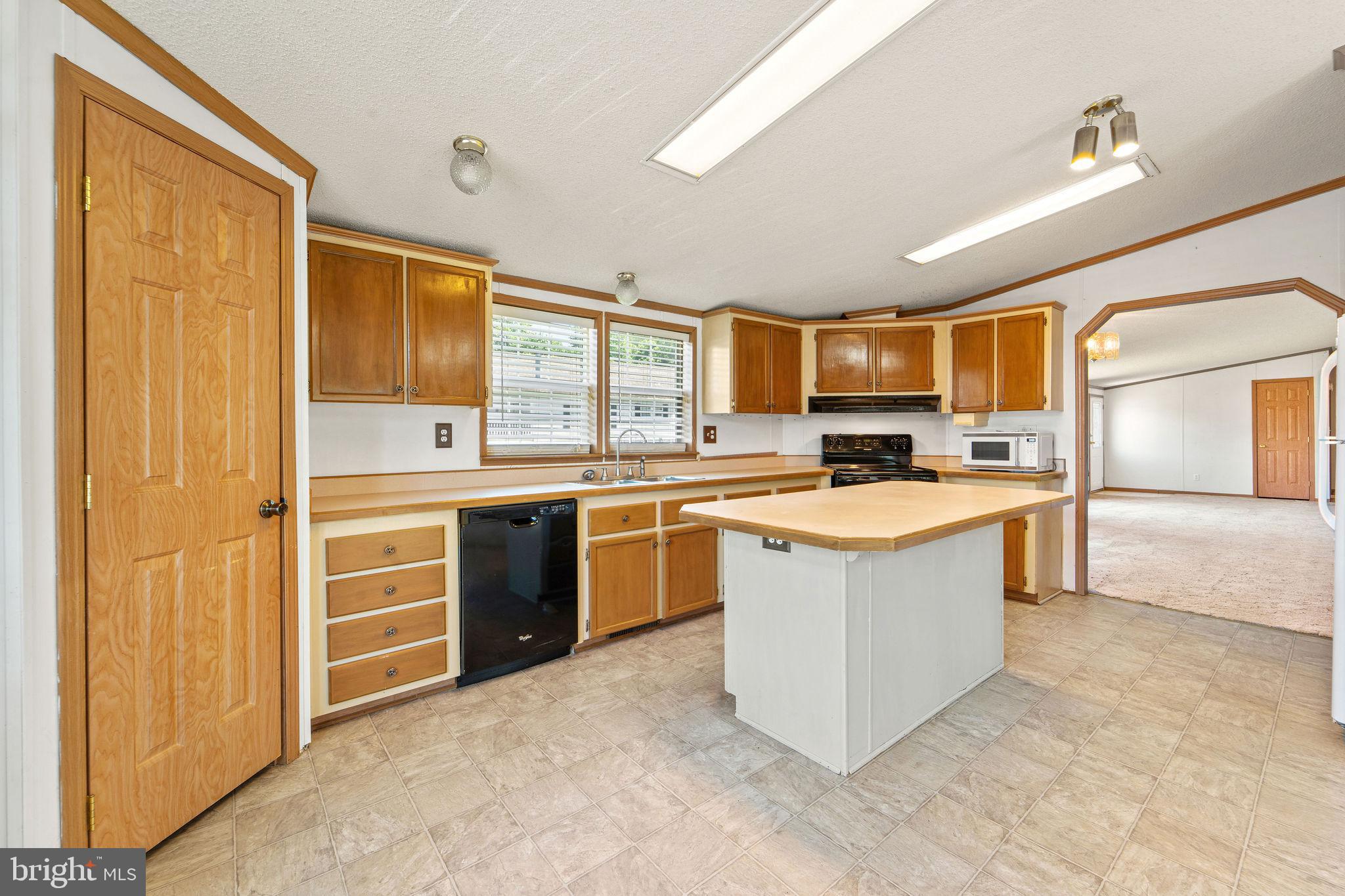 402 Ford Hook Road Doylestown, PA 18901 - Photo 18 of 26 a kitchen with granite countertop a stove top oven and cabinets