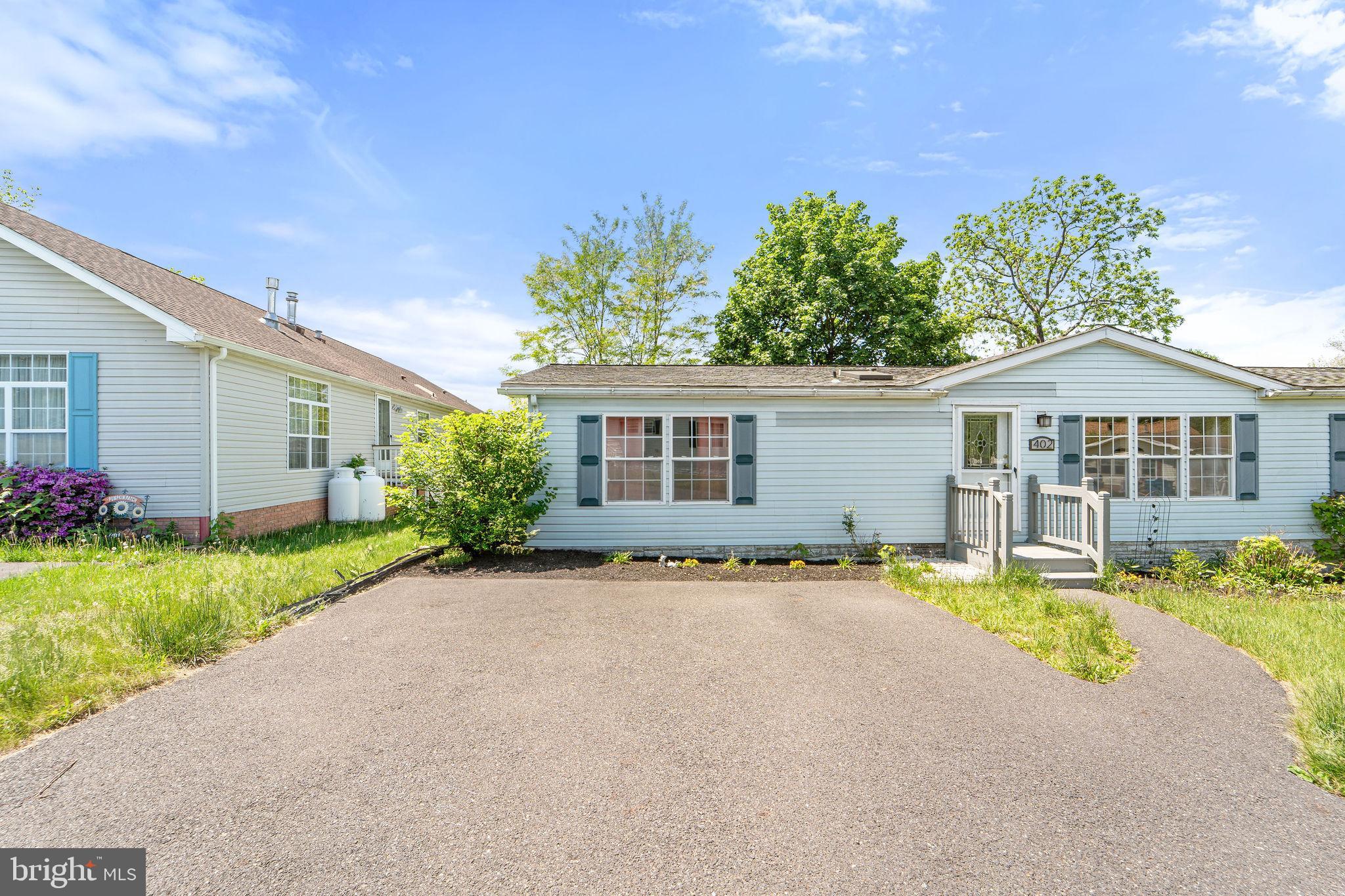 402 Ford Hook Road Doylestown, PA 18901 - Photo 2 of 26 front view of a house with a patio