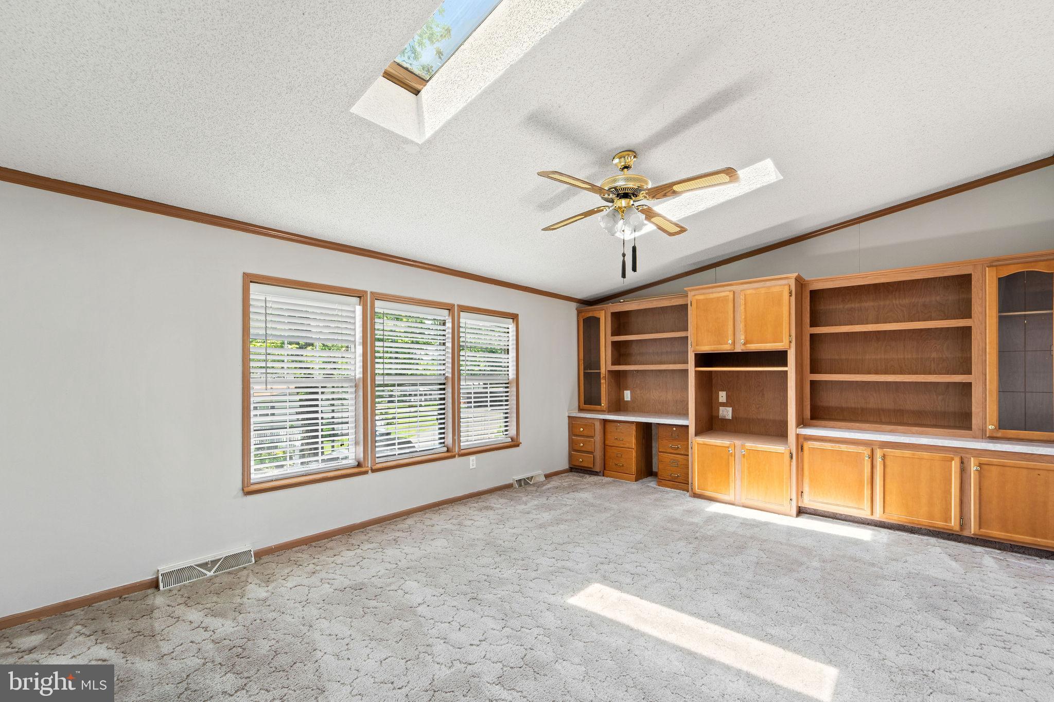 402 Ford Hook Road Doylestown, PA 18901 - Photo 22 of 26 an empty room with a large window and ceiling fan