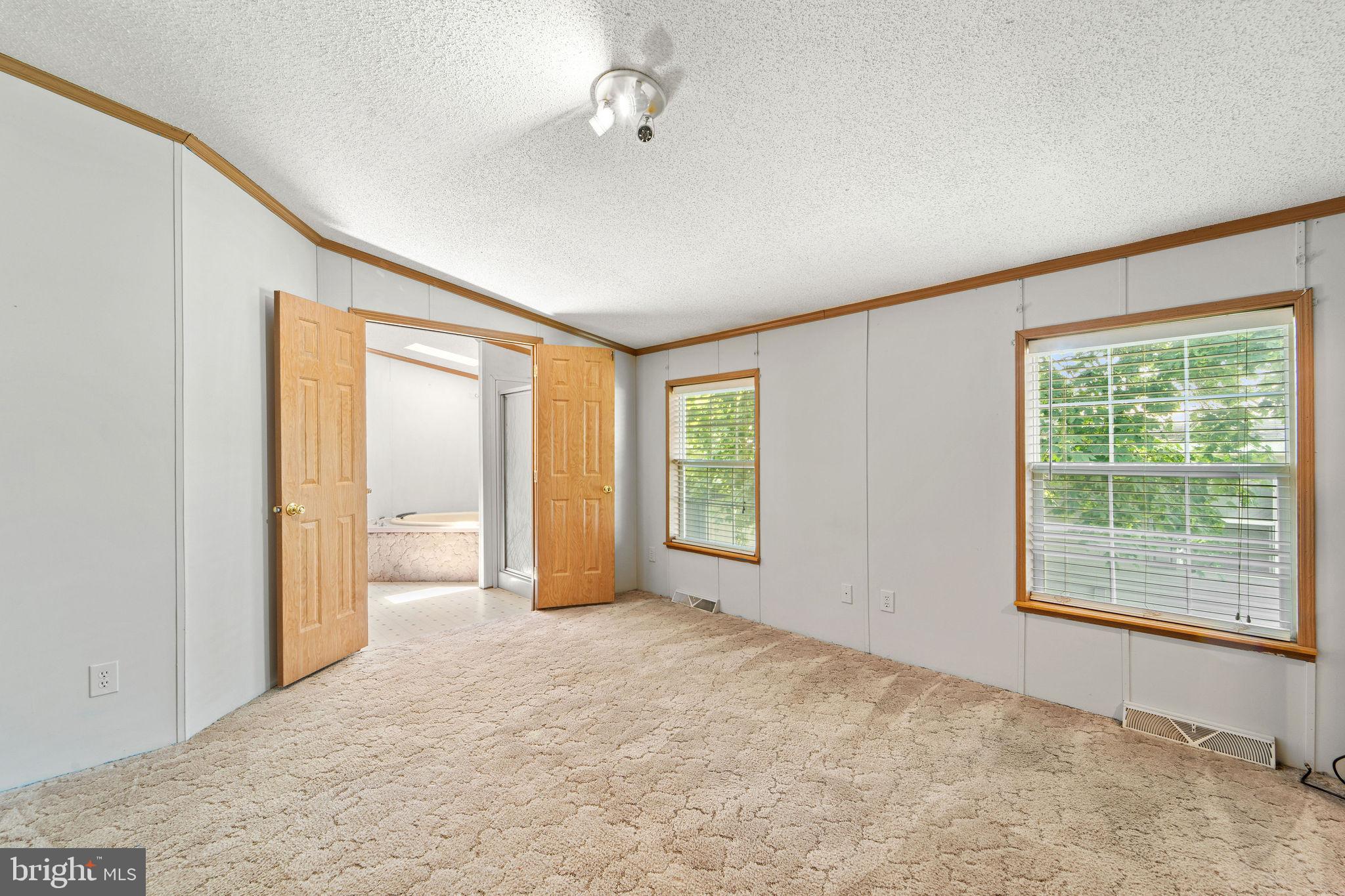 402 Ford Hook Road Doylestown, PA 18901 - Photo 23 of 26 an empty room with windows and closet