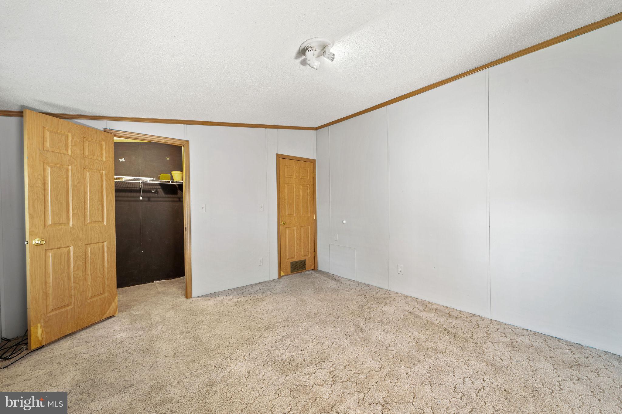 402 Ford Hook Road Doylestown, PA 18901 - Photo 25 of 26 an empty room with closet and a chandelier fan
