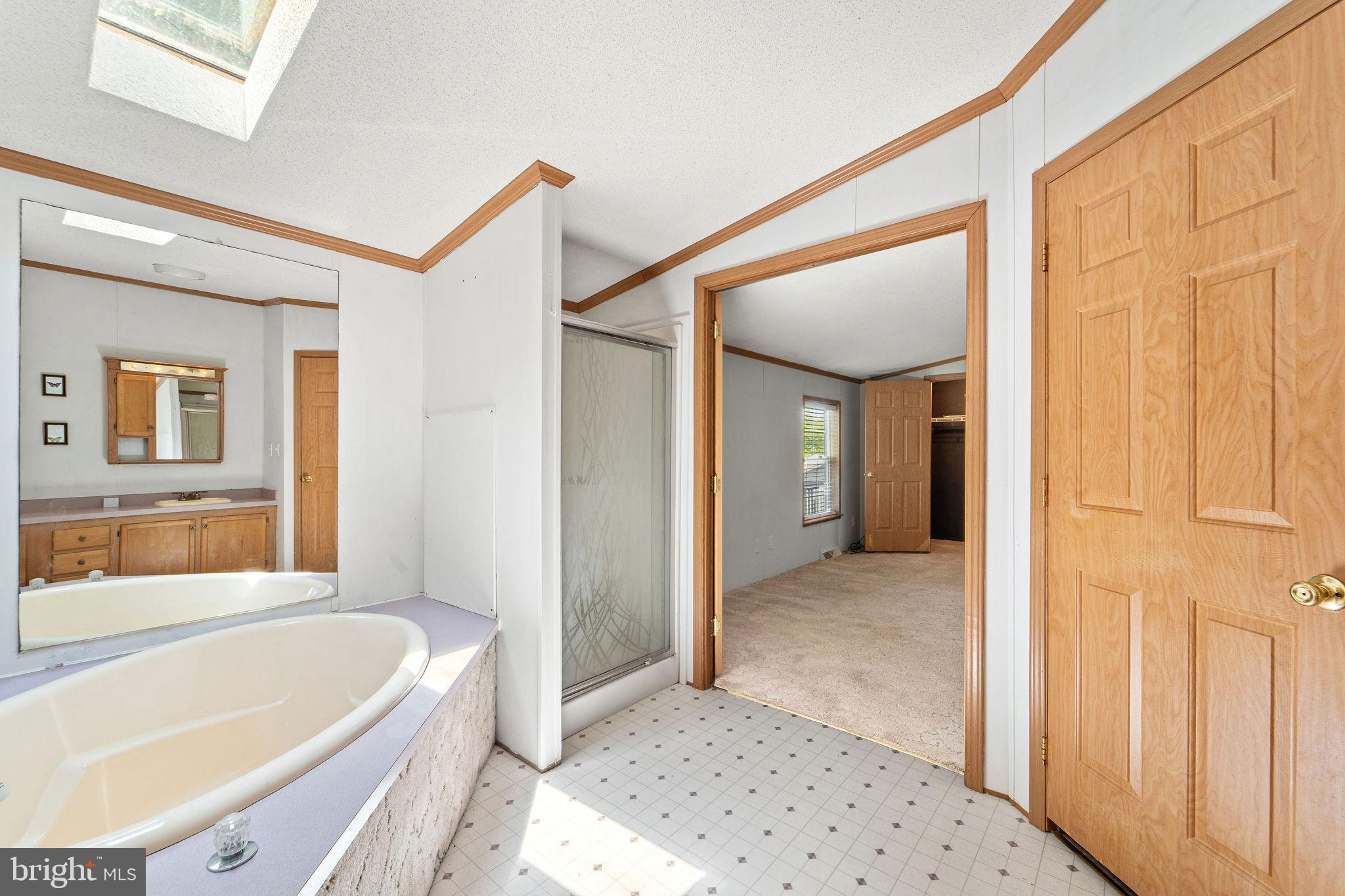 402 Ford Hook Road Doylestown, PA 18901 - Photo 26 of 26 a bathroom with a tub shower and a sink