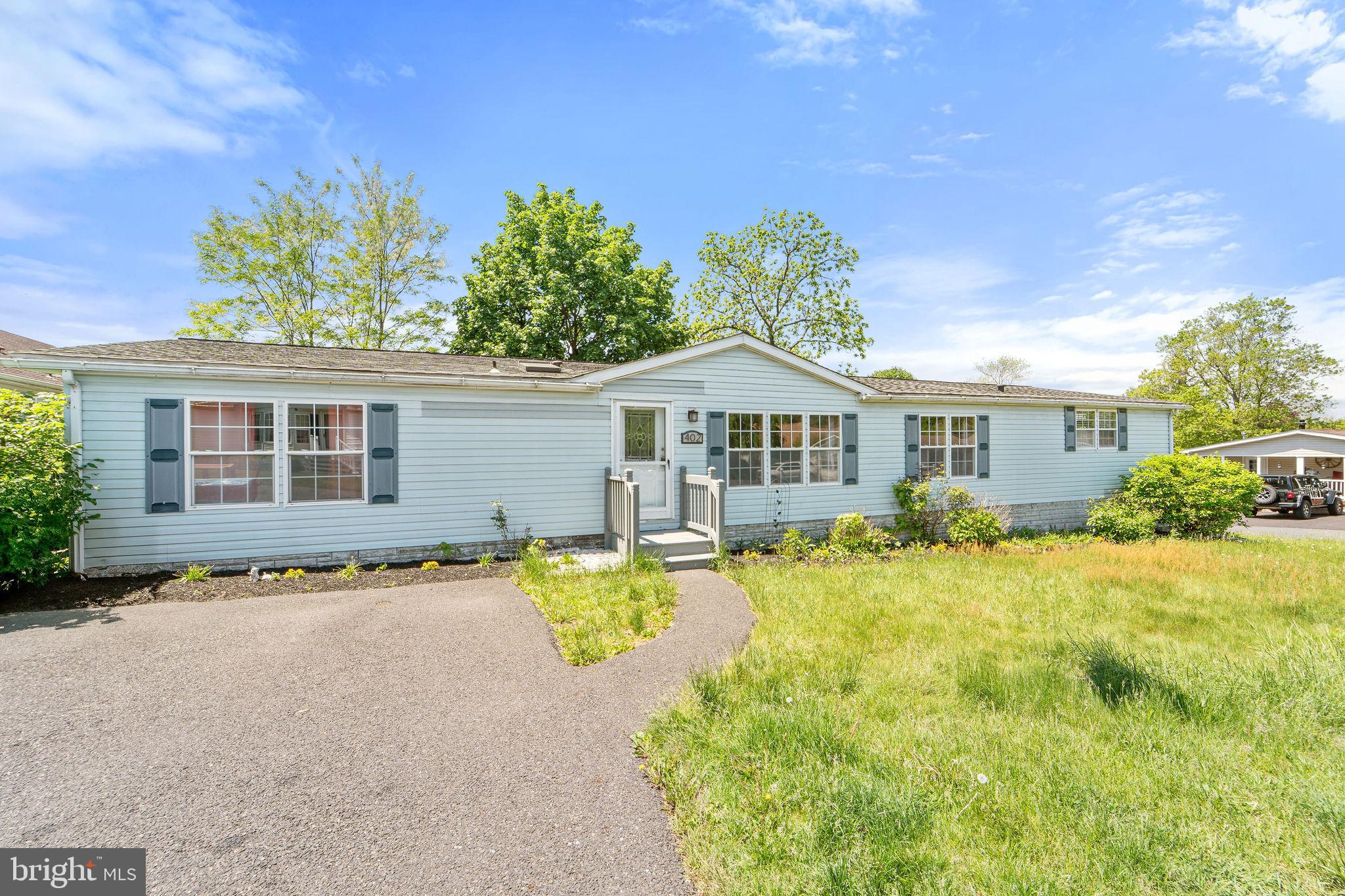 402 Ford Hook Road Doylestown, PA 18901 - Photo 3 of 26 a front view of a house with a yard