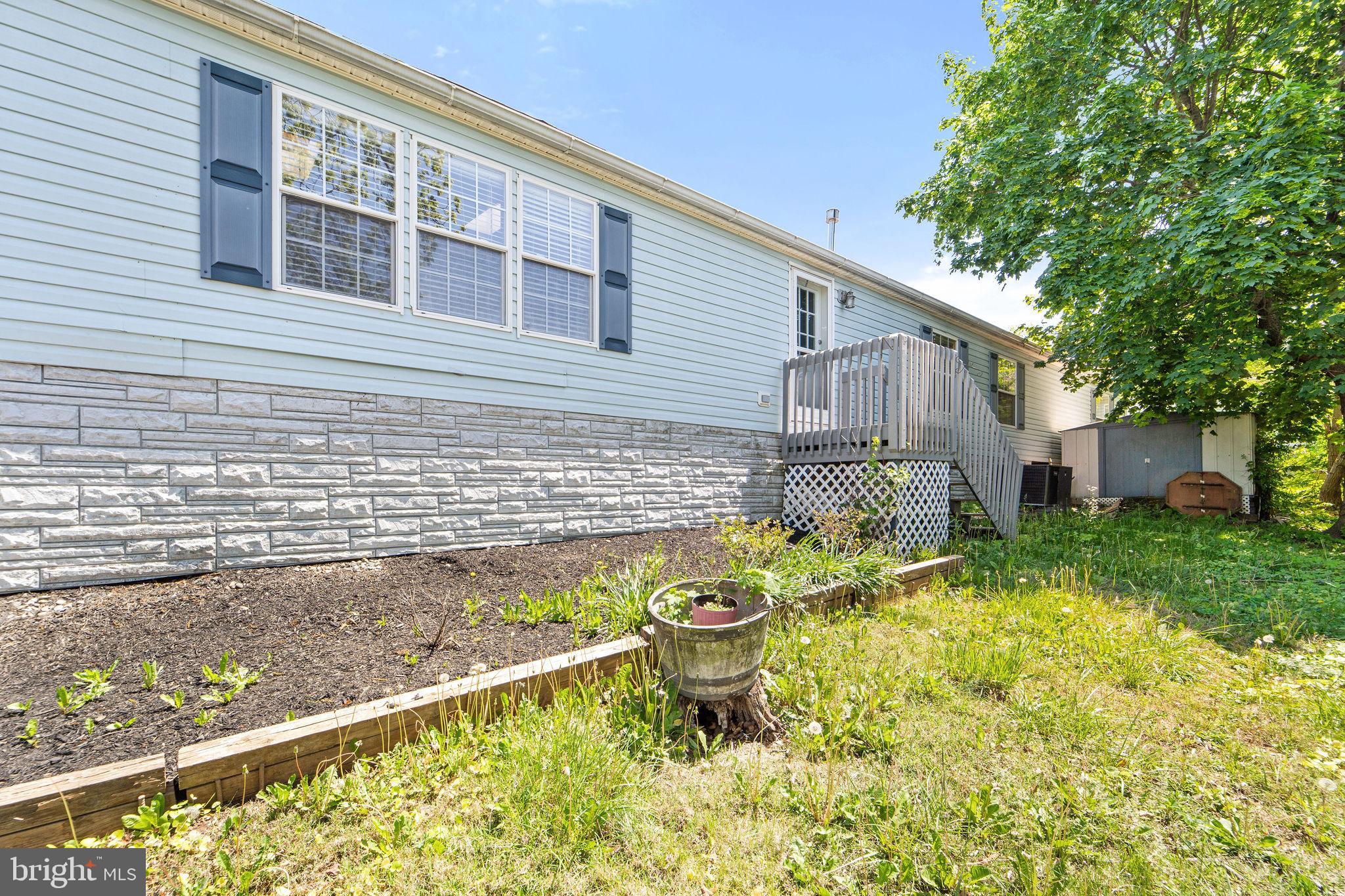 402 Ford Hook Road Doylestown, PA 18901 - Photo 4 of 26 a front view of a house with a yard