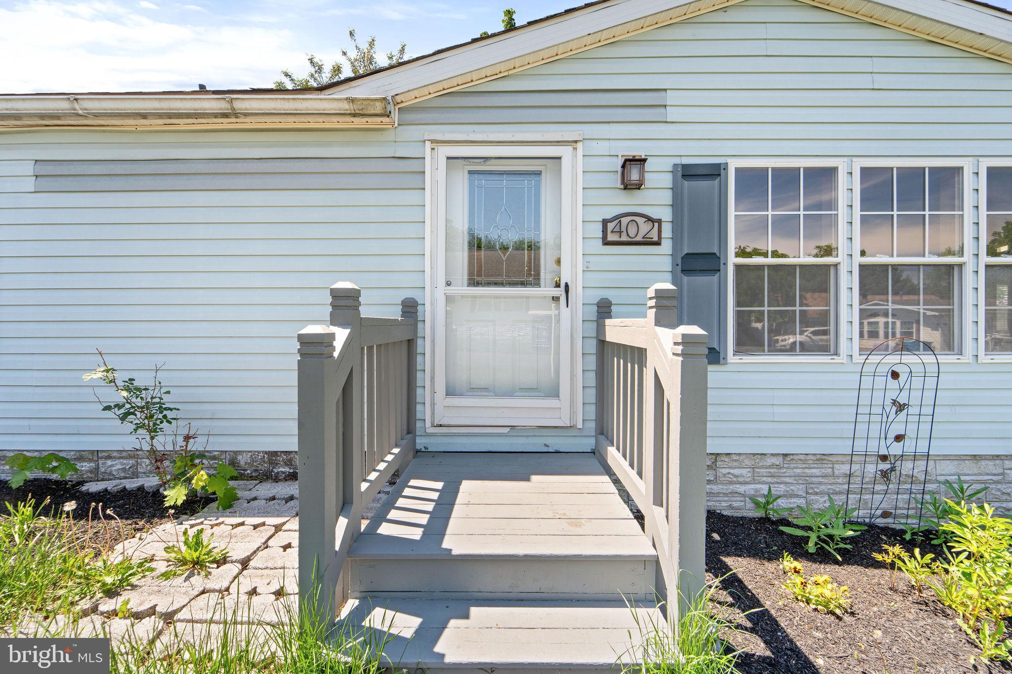 402 Ford Hook Road Doylestown, PA 18901 - Photo 6 of 26 a front view of a house with a garden