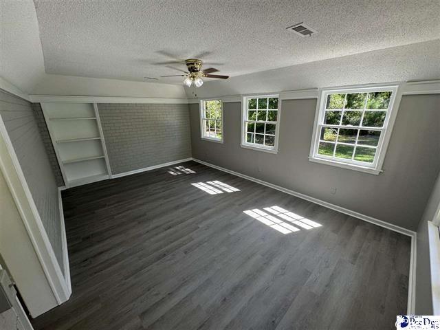 1057 Sam Lee Road Scranton, SC 29591 - Photo 13 of 23 Unfurnished bedroom featuring a textured ceiling,