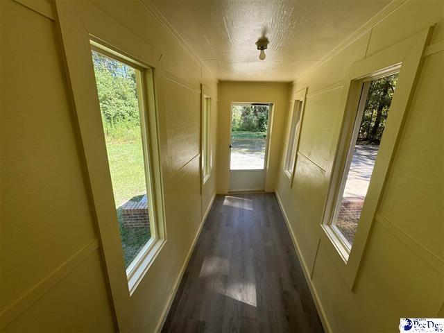 1057 Sam Lee Road Scranton, SC 29591 - Photo 19 of 23 Doorway with dark hardwood / wood-style flooring