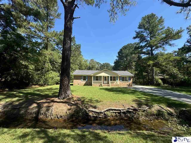 1057 Sam Lee Road Scranton, SC 29591 - Photo 23 of 23 Ranch-style house featuring a front lawn