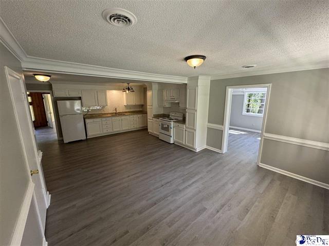 1057 Sam Lee Road Scranton, SC 29591 - Photo 5 of 23 Unfurnished living room with sink, crown molding,