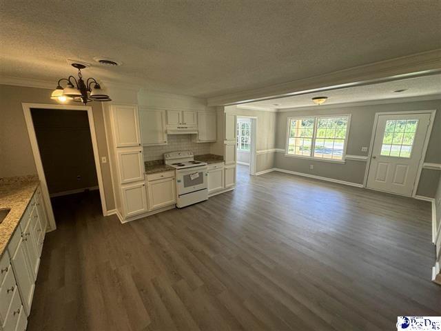 1057 Sam Lee Road Scranton, SC 29591 - Photo 6 of 23 Kitchen featuring an inviting chandelier, white el