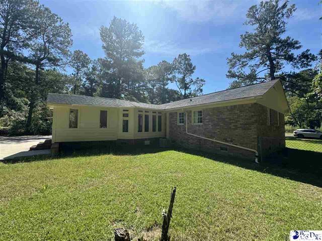 1057 Sam Lee Road Scranton, SC 29591 - Photo 10 of 23 Back of house with a yard