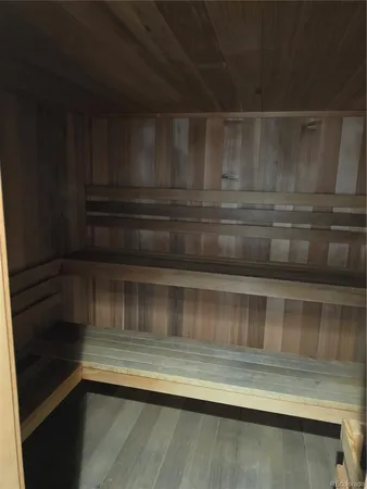 a room with a table and a wooden floor