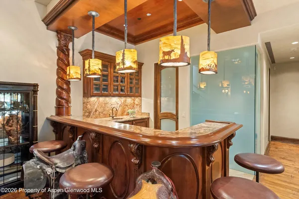 a view of a workspace with bookshelf