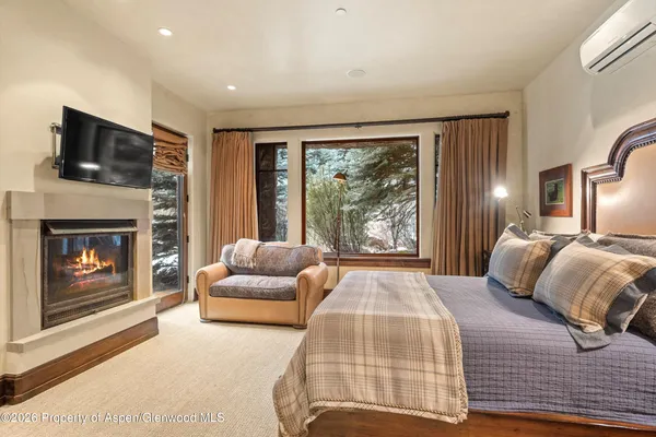a bathroom with a double vanity sink a mirror and a shower