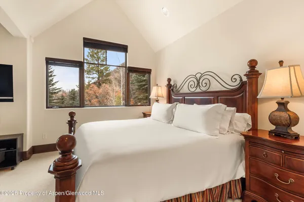 a bathroom with a sink a mirror and a shower
