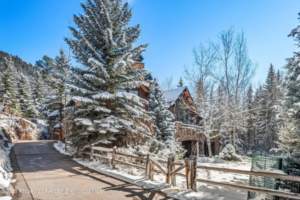 a aerial view of a house with table and chairs