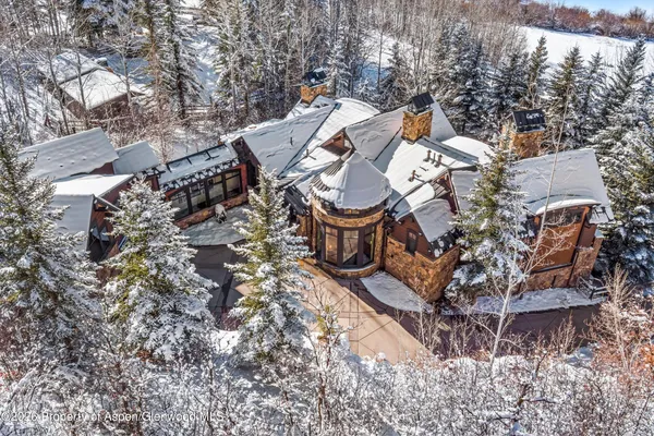 a kitchen with a stove a sink dishwasher and a refrigerator