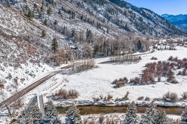 a spacious bathroom with a granite countertop sink mirror and shower