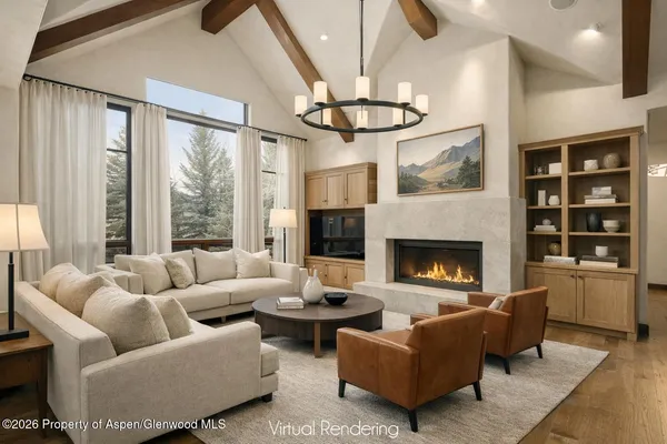 a living room with furniture a flat screen tv and a fireplace