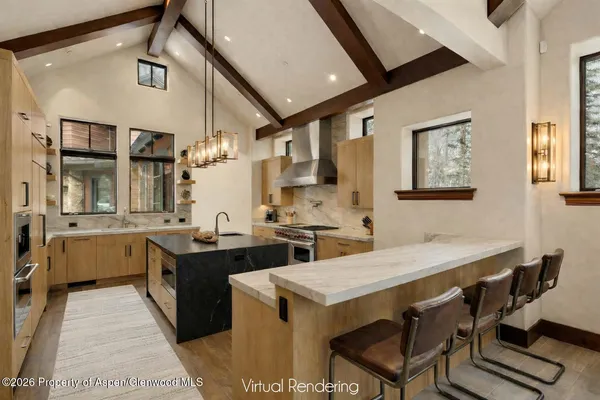 a bedroom with a large bed and a flat tv screen on dresser