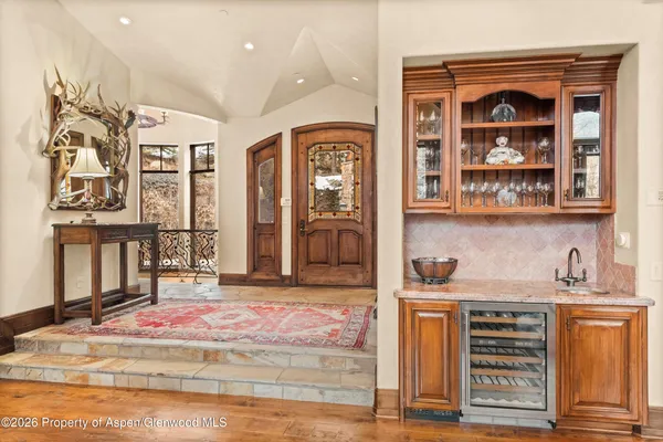 a view of an entryway with wooden floor