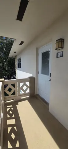 a front view of a building with a yard