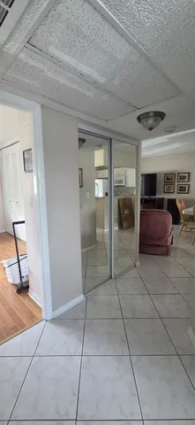 a view of a livingroom with furniture and closet