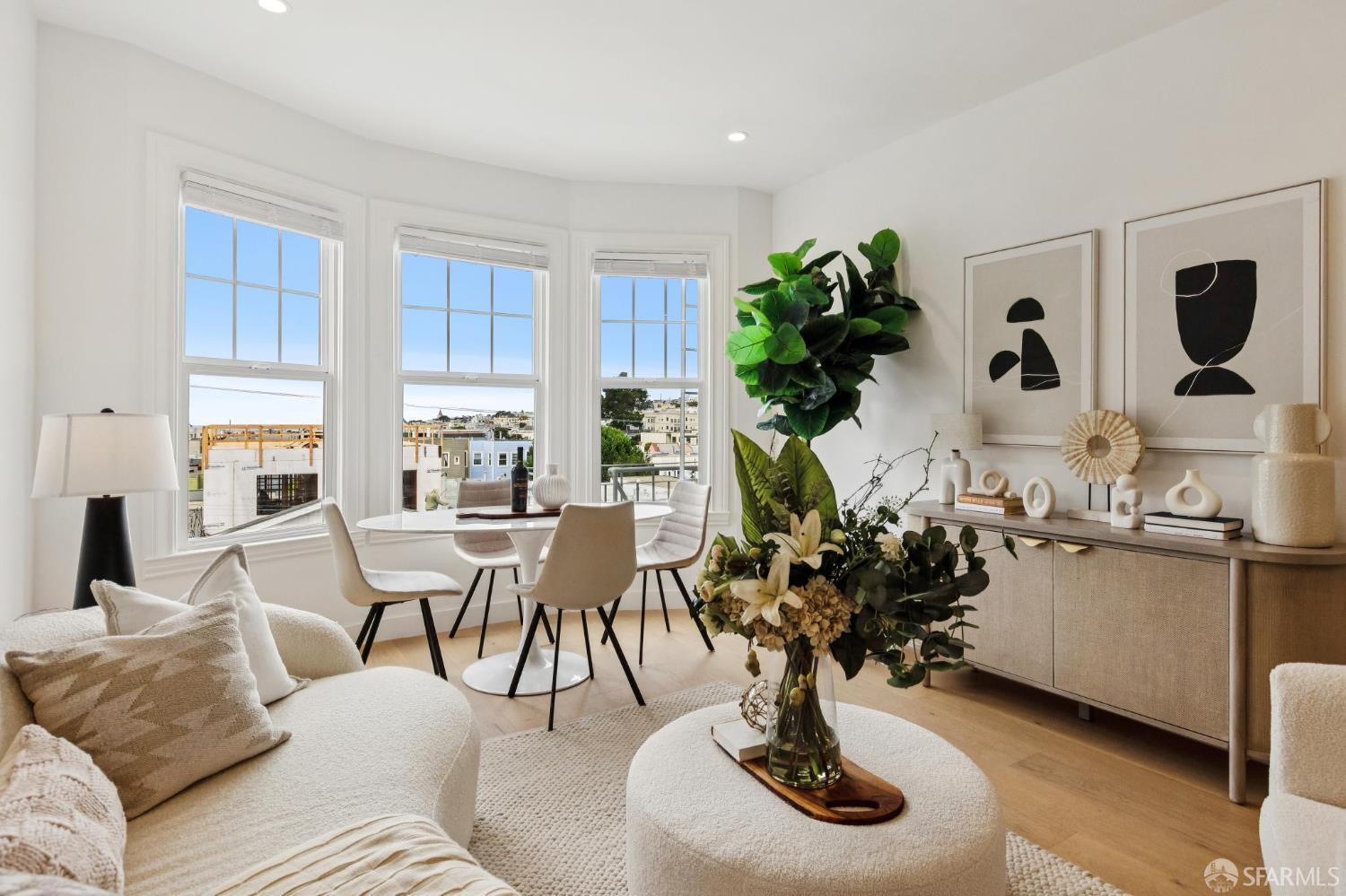 880 26th Avenue, Unit 3 San Francisco, CA 94121 - Photo 2 of 13 a living room with furniture potted plant and kitchen view
