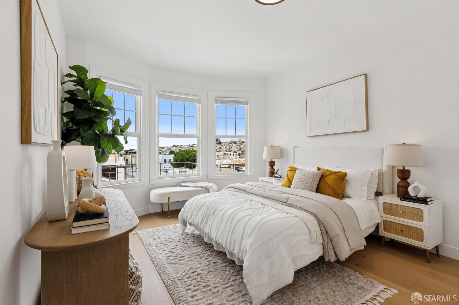 880 26th Avenue, Unit 3 San Francisco, CA 94121 - Photo 6 of 13 a bedroom with bed and a potted plant