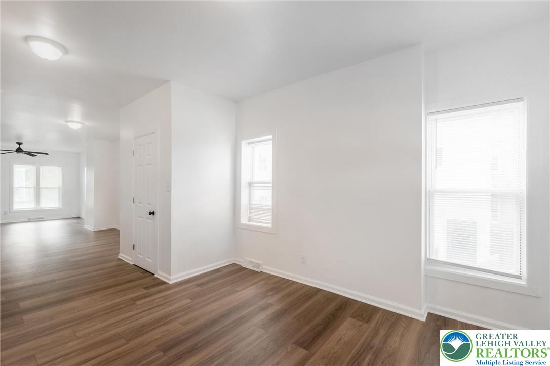 909 South Hall Street Allentown, PA 18103 - Photo 17 of 36 a view of an empty room with wooden floor and a window