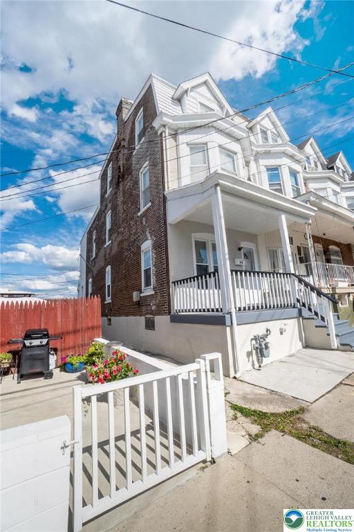 909 South Hall Street Allentown, PA 18103 - Photo 2 of 36 a view of a white house with iron fence