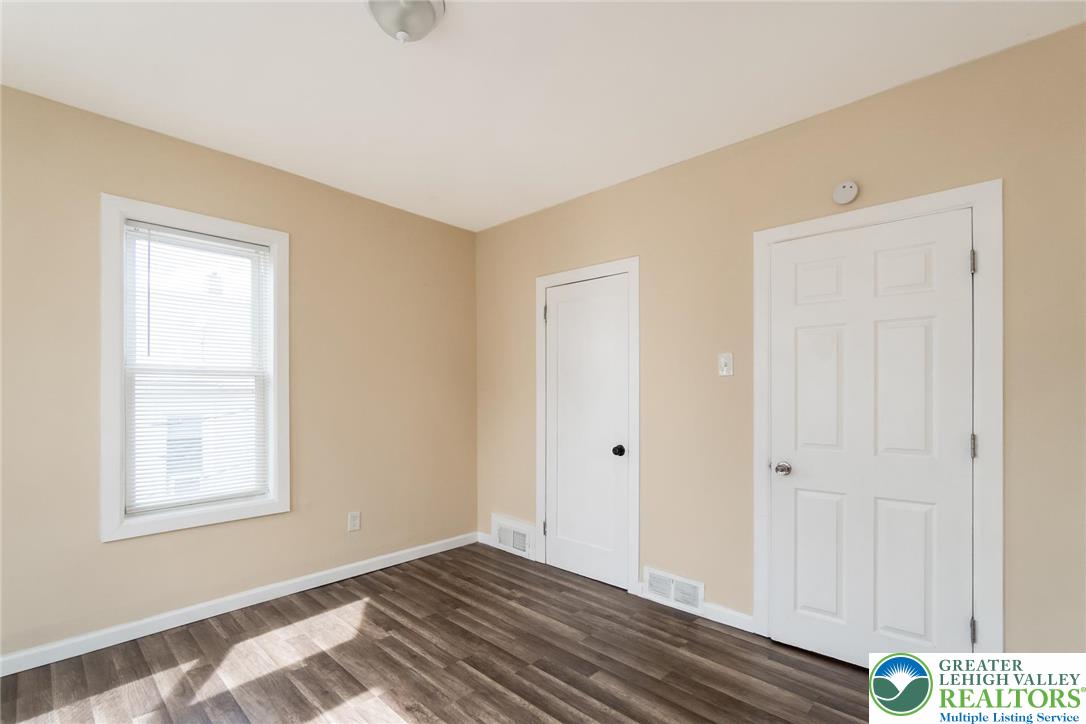 909 South Hall Street Allentown, PA 18103 - Photo 30 of 36 a view of an empty room with wooden floor and a window