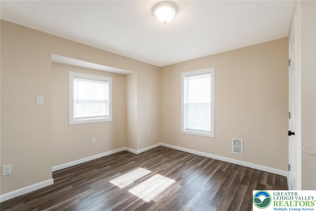 909 South Hall Street Allentown, PA 18103 - Photo 31 of 36 a view of empty room with wooden floor and fan
