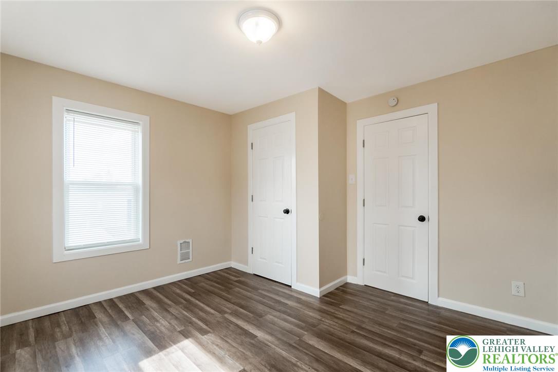 909 South Hall Street Allentown, PA 18103 - Photo 32 of 36 a view of an empty room with wooden floor and a window