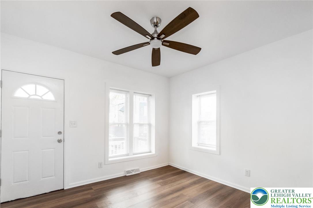 909 South Hall Street Allentown, PA 18103 - Photo 6 of 36 a view of a livingroom with a window and wooden floor