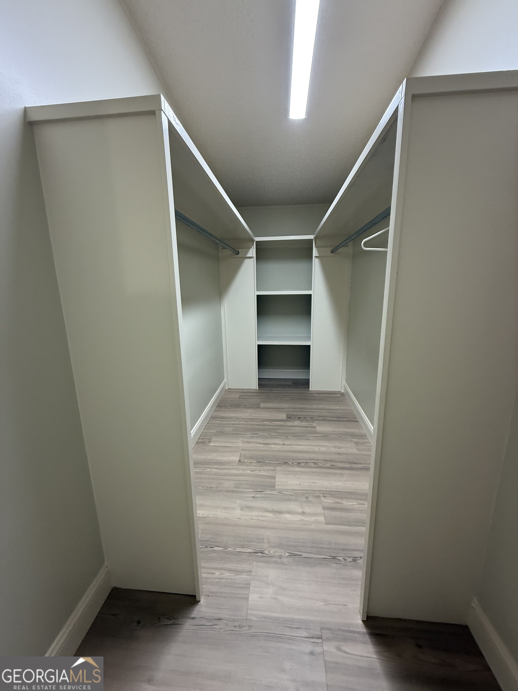 179 Creek Ridge Road Claxton, GA 30417 - Photo 14 of 19 a view of walk in closet with empty racks