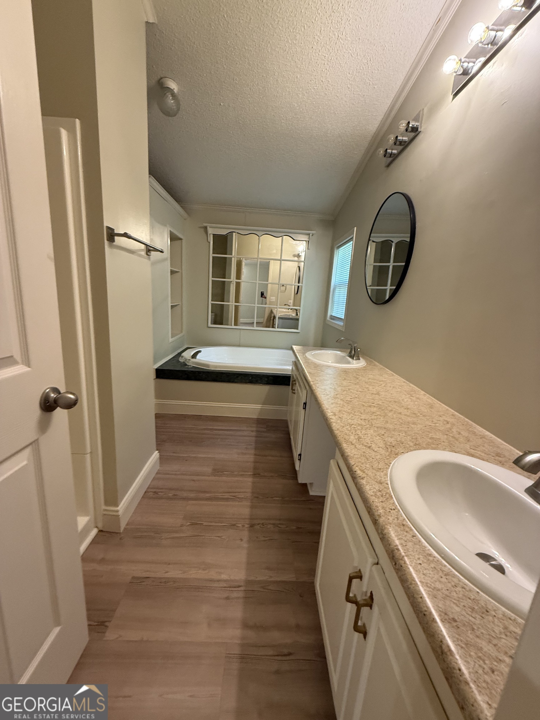 179 Creek Ridge Road Claxton, GA 30417 - Photo 15 of 19 a bathroom with a granite countertop double vanity sink and mirror