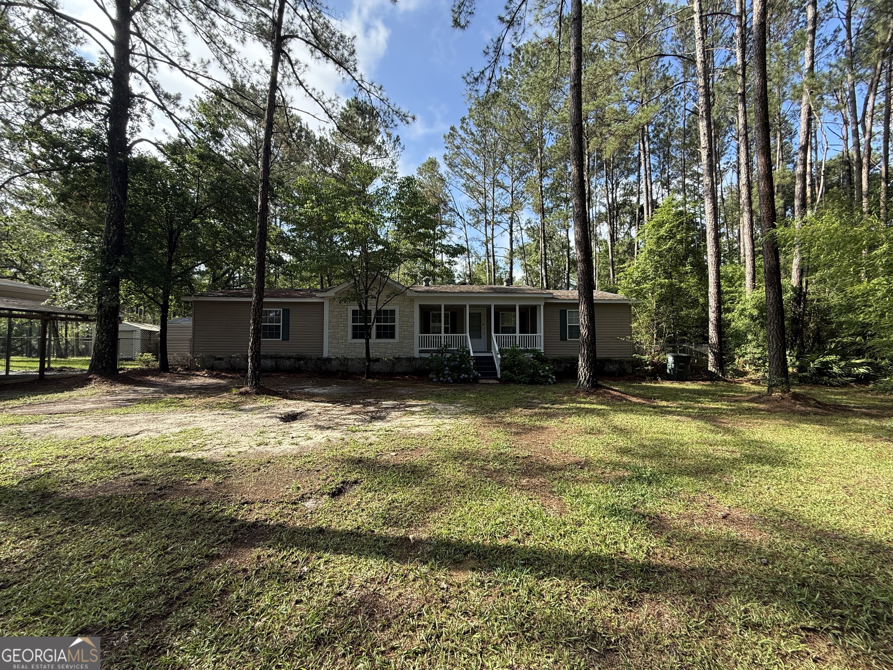 179 Creek Ridge Road Claxton, GA 30417 - Photo 2 of 19 a front view of a house with a yard