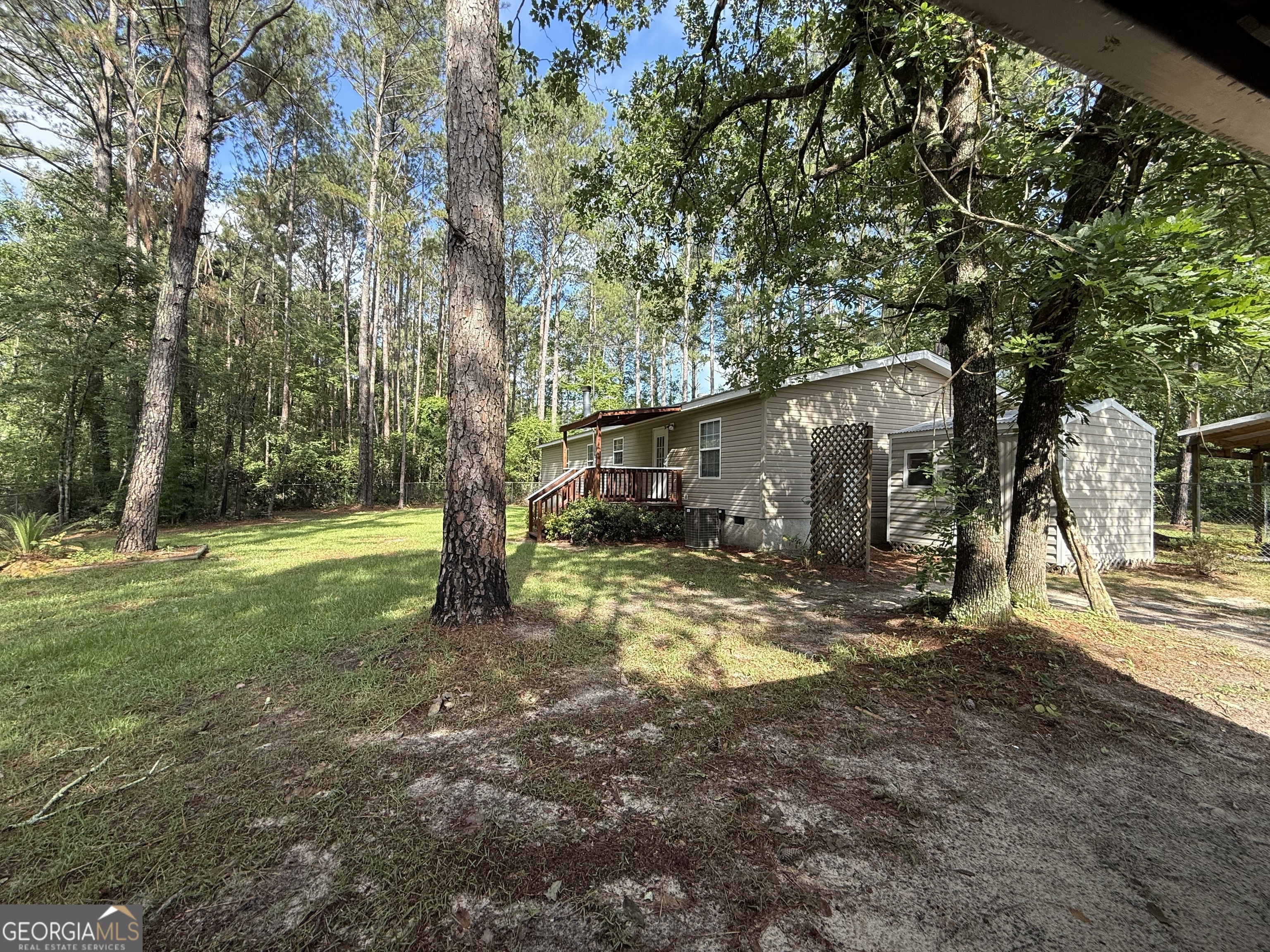 179 Creek Ridge Road Claxton, GA 30417 - Photo 3 of 19 a view of a house with backyard and a tree