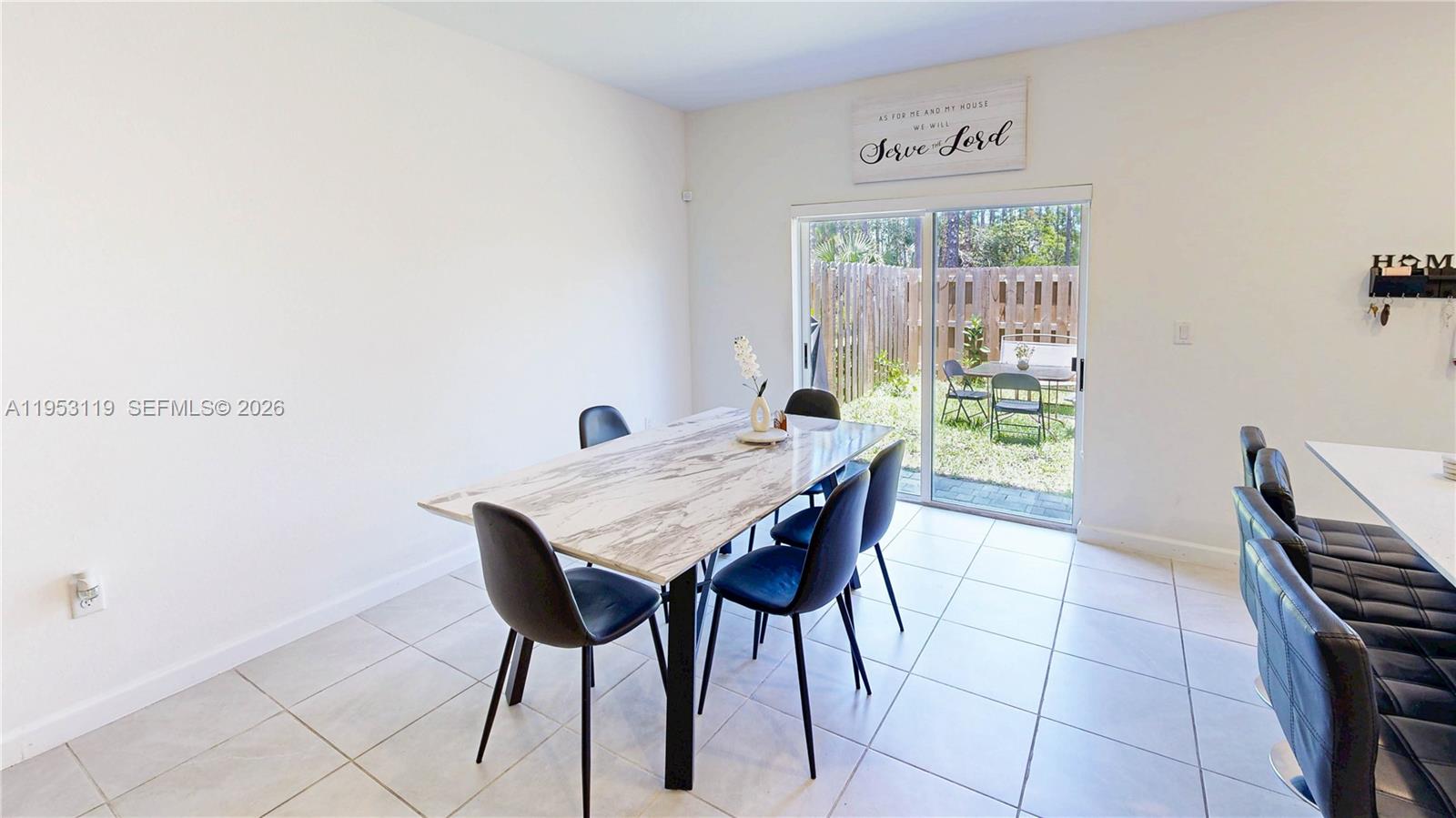 16233 Southwest 290th Terrace Homestead, FL 33033 - Photo 13 of 43 a view of a dining room with furniture and a window