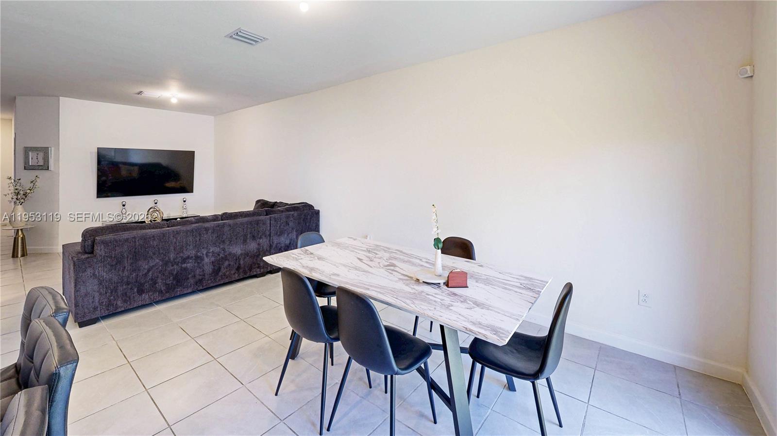 16233 Southwest 290th Terrace Homestead, FL 33033 - Photo 14 of 43 a view of a dining room with furniture and wooden floor