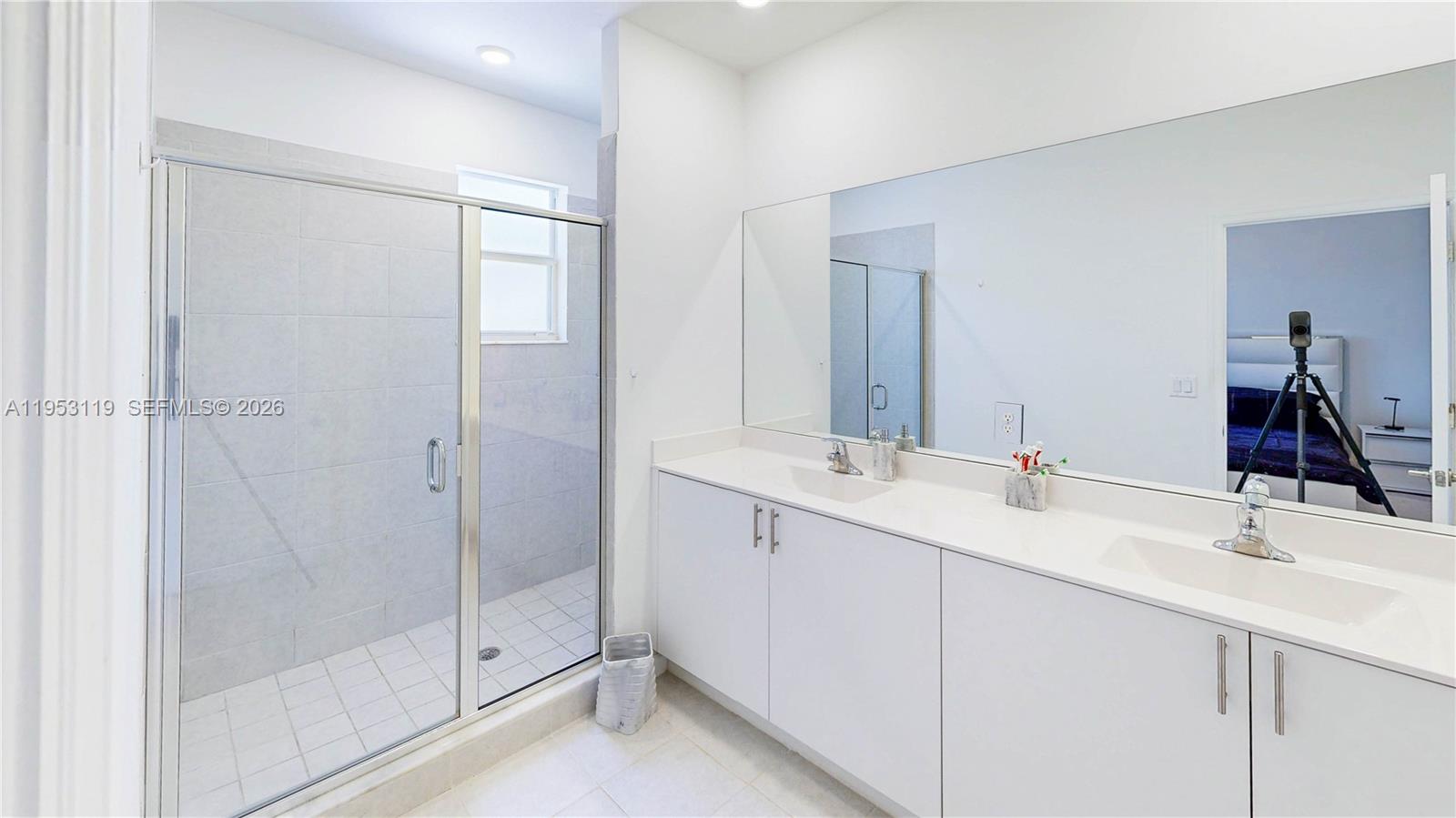 16233 Southwest 290th Terrace Homestead, FL 33033 - Photo 21 of 43 a bathroom with a double vanity sink mirror and shower